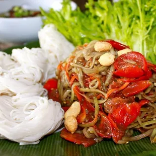 a plate of noodles and vegetables