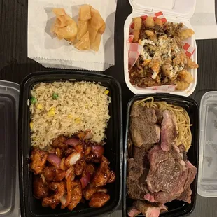 Crab rangoons, general tso&quot;s chicken with fried rice, steak with garlic noodles, and Philly cheesesteak fries.