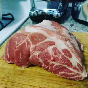 a piece of meat on a cutting board
