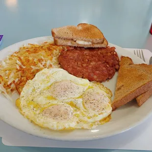 3 eggs Triple with hashbrowns, wheat toast and corned beef!! Tasted just like it was homemade