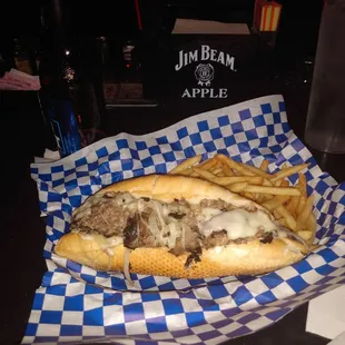 Steak &amp; cheese sandwich  w/ shoestring fries