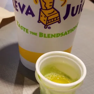 a blender and a cup on a table