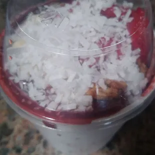a dessert in a plastic cup
