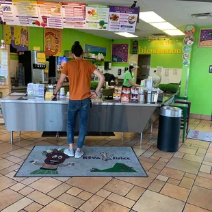 a man standing at a counter