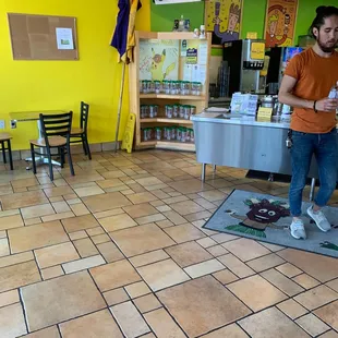 a man standing in a coffee shop
