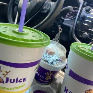 two cups of juice and a spoon