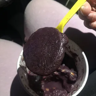 Blueberry açaí bowl with huge frozen unblended chunk of açaí