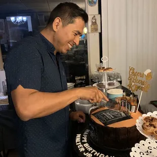 The look on his face and how happy he was with his surprised cake