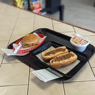 two hot dogs on a tray