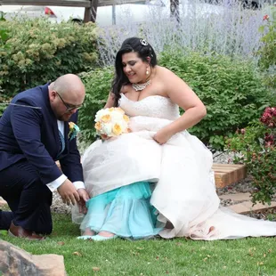 Love this shoot of my new husband helping me take off my shoes.