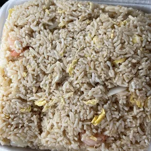 a rice dish in a styrofoam container