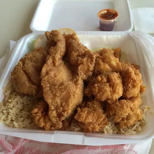 Large seafood platter. They put all the food in a to go box even though you're dining just in case you don't finish it.