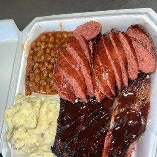 2 meat Combo Plate including Ribs and Sausage with Brisket baked beans and Homemade Potato salad