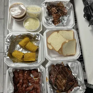 Brisket, ribs, and sausage + potatoe salad, beans, corn