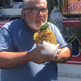 My uncle enjoying a drink from $5 Bento Box on the island of Honolulu.