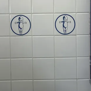 the &apos;Kewpee doll&apos; on the wall tiling.