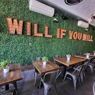 a dining area with tables and chairs