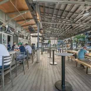 people sitting at tables in a restaurant
