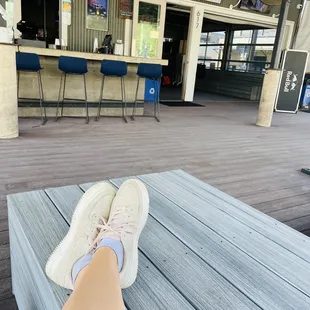 a person&apos;s feet on a bench