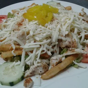 Grilled chicken salad loaded with veggies, French fries, &amp; Cheese. Served daily from 11am to close.