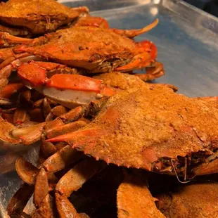 a pile of crabs on a tray