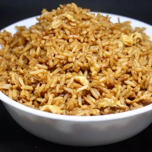 a white bowl filled with brown rice