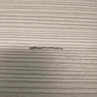 Metal piece found in drummet