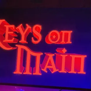 a neon sign for key&apos;s on main