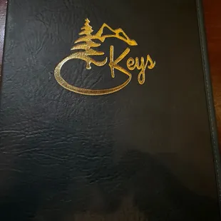 the logo on the black book