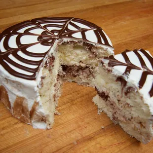 a half eaten cake on a wooden table