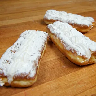 three pastries on a wooden table