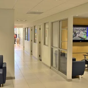 Comfy chairs or a workspace for work and a 60" HDTV with CoxCable.