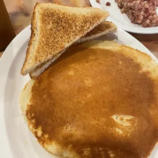 a plate of pancakes and bacon