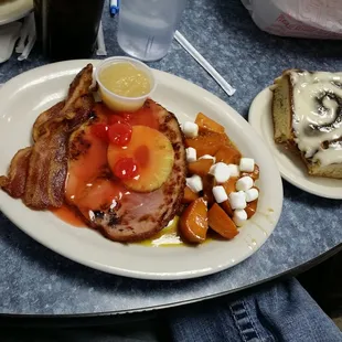 Easter special. Ham steak, homemade applesauce, candied yams, and they let me sub veggies for a couple slices of THICK bacon!