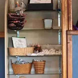 Cleaning products above premade chip baskets &amp; cleaning rag actually hanging in the chips below.