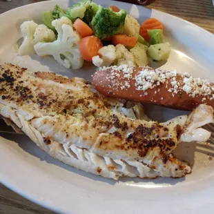 Grilled cod (some of the best I&apos;ve ever eaten!) and mixed veggies and a scrumptious bread stick! All soooo good!
