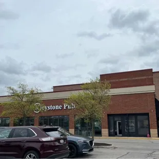 Store front. Parking lot shared with movie theater.