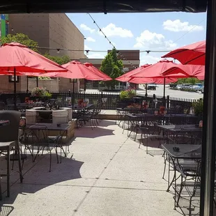 patio seating with red umbrellas