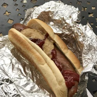 a hot dog with ketchup