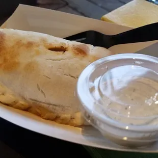 Empanada, chicken, green and red peppers, onions green chili sauce