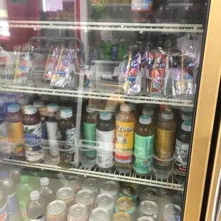 a refrigerator full of sodas and condiments