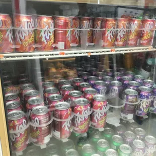 a refrigerator full of sodas