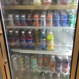 a refrigerator full of sodas
