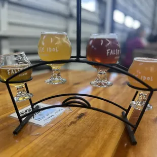 a flight of beers on a table