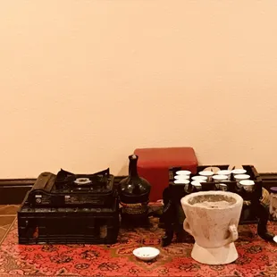 a coffee table with cups and a camera