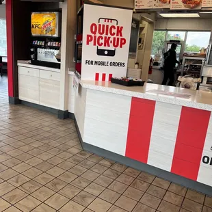 a fast food restaurant with a quick pick up sign