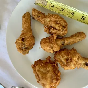 Look how small these chicken pieces are. Horrible quality control from KFC