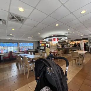 the inside of a restaurant with tables and chairs