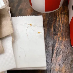 a cup of coffee and a piece of paper on a table