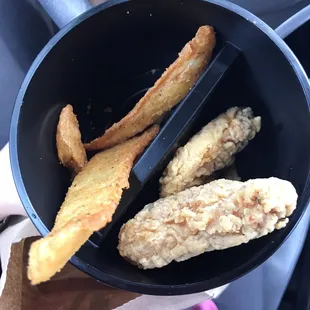 My sad go cup with three wings and three sad wedges. Worst KFC I have been to by far.